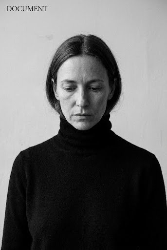 A founder, photographed chin-down
